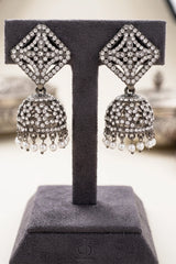 Oxidized Black-Silver Square Jhumka Earrings with Sparkling Stones and Pearl Drop Tassels