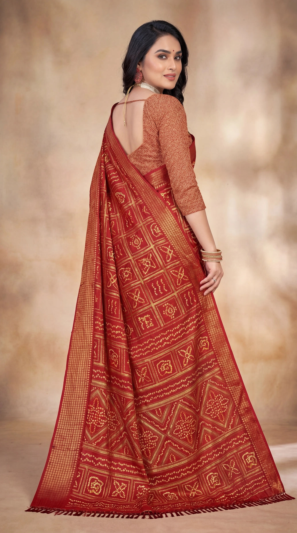 Red Bandhani Print Chiffon Saree with Gold Zari Motifs and Geometric Border for Festive Wear