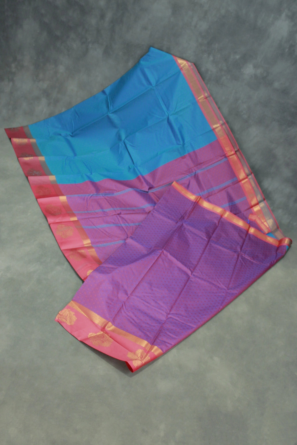 Peacock Blue Emboss Satin Border Semi Silk Saree with Floral Design and Blouse Piece