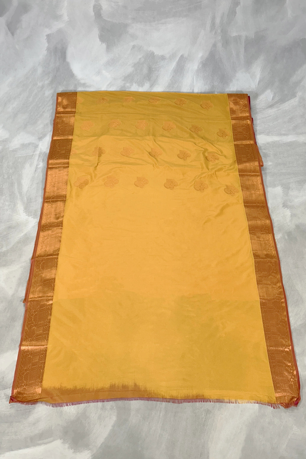 Mustard Border Soft Silk Saree with Delicate Gold Zari Buttas and Traditional Floral Border