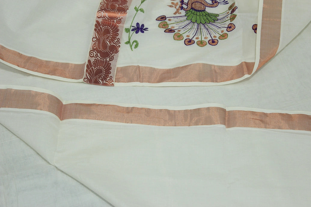 Fabric: Pure Kerala Cotton – lightweight, breathable, 
        •        Design: Rich machine embroidery in Copper zari and thread with detai