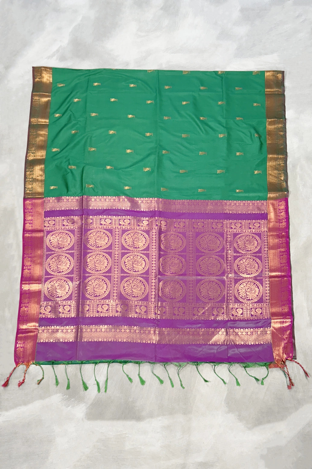 Green Semi Soft Silk Saree with Purple Contrast Border, Gold Zari Buttas & Traditional Floral Border