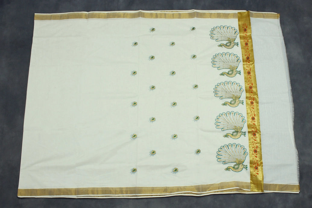 Fabric: Pure Kerala Cotton – lightweight, breathable, 
        •        Design: Rich machine embroidery in Gold zari and thread with detaile