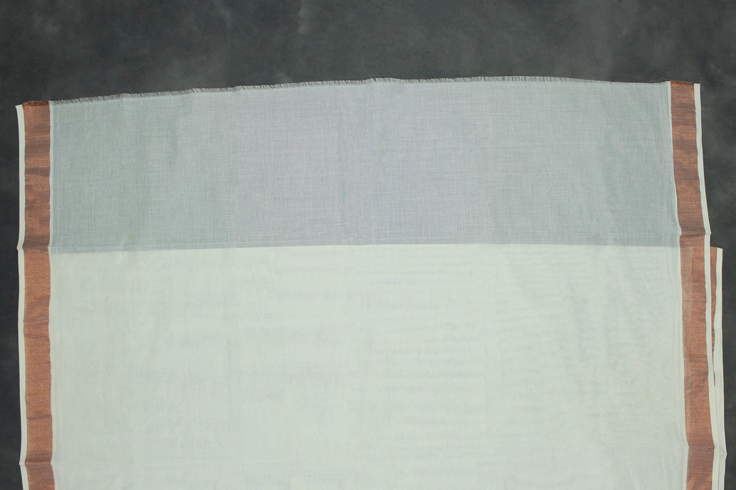 Fabric: Pure Kerala Cotton – lightweight, breathable, 
        •        Design: Rich machine embroidery in Copper zari and thread with detai