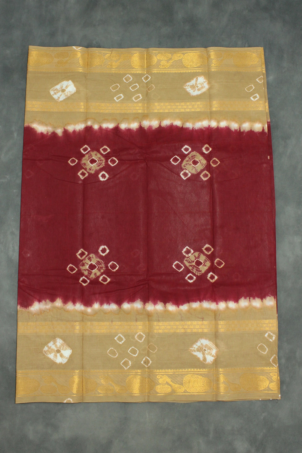 Maroon Sungudi Cotton Bandhani Saree with Golden Zari Border and Traditional Instrument Motifs, Unstitched Blouse Included Saree JCS Fashions