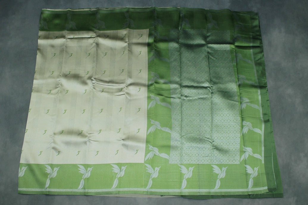 Beige & Green Kubera Silk Pattu Saree with Zari Border and Bird Design Blouse