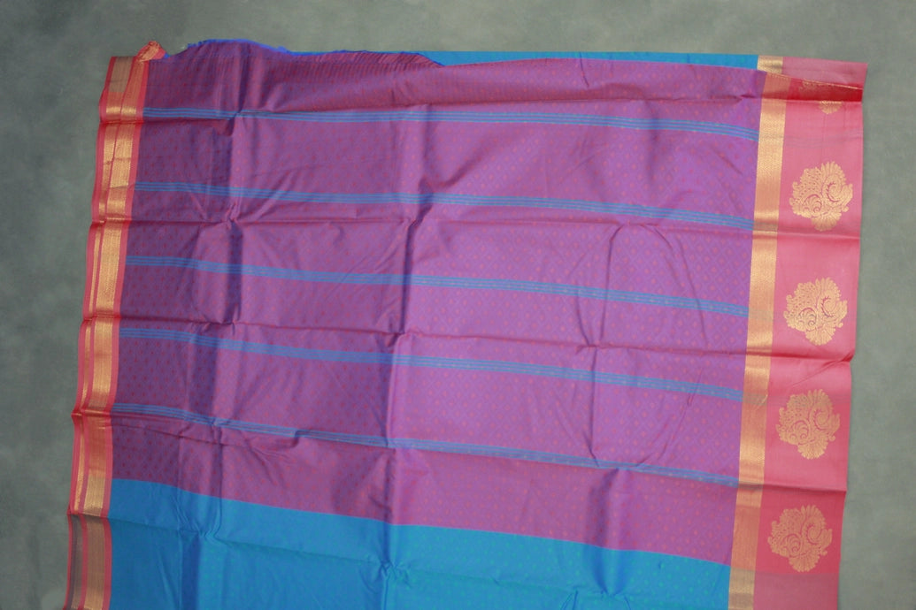 Peacock Blue Emboss Satin Border Semi Silk Saree with Floral Design and Blouse Piece
