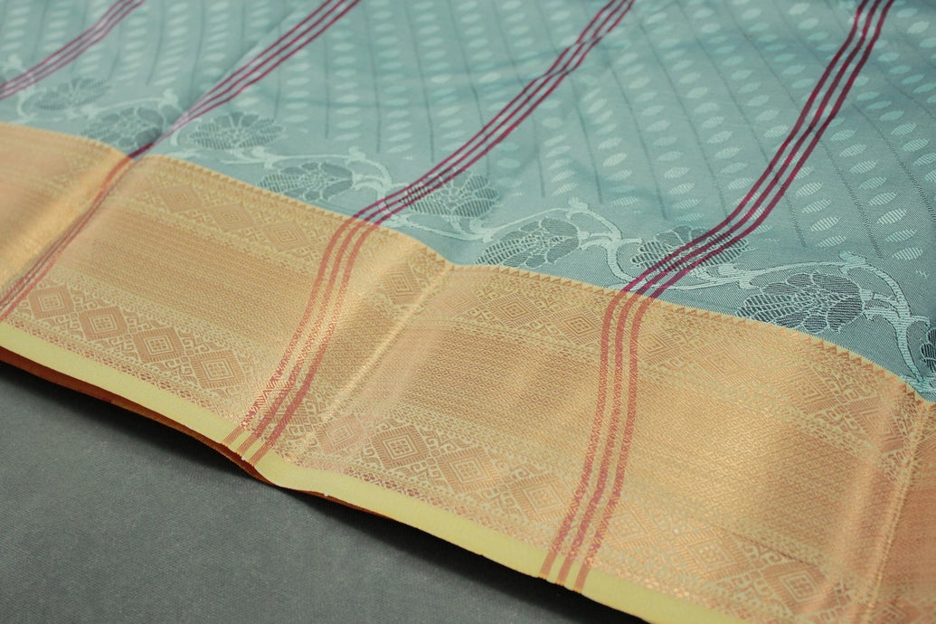 Maroon Emboss Silk Saree with Contrast Zari-Style Border and Semi Silk Design