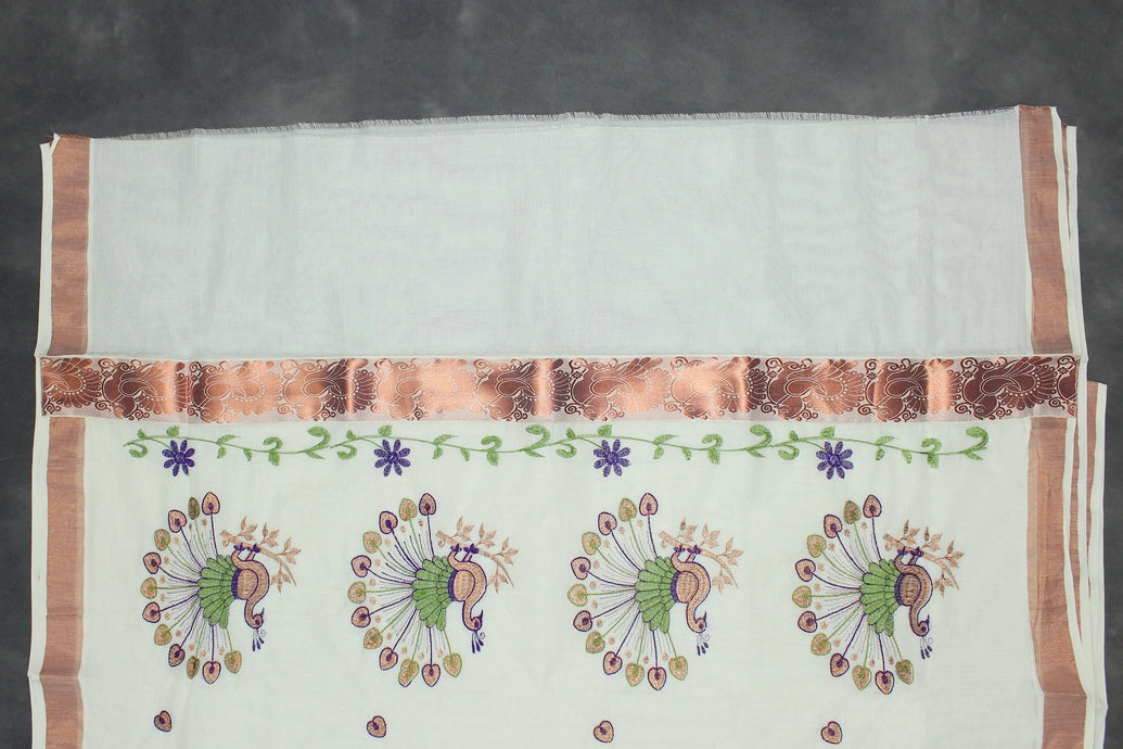 White Kerala Cotton Saree with Rich Peacock Machine Embroidery in Copper Zari and Delicate Copper Border