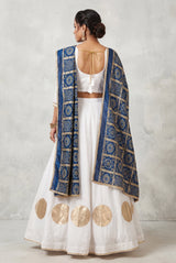 White Navratri Chaniya Choli Set with Gold Circle Motif & Plain Flared Skirt for Festive Party Wear