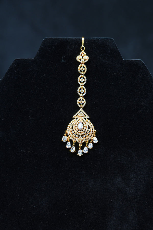 Glamour in Gold: AD Stone Tikka for Divine Elegance at JCSFashions