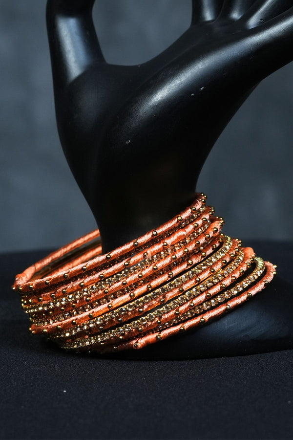 Luxe Golden Touch: Set of 23 Silk Thread Bangles at JCSFashions
