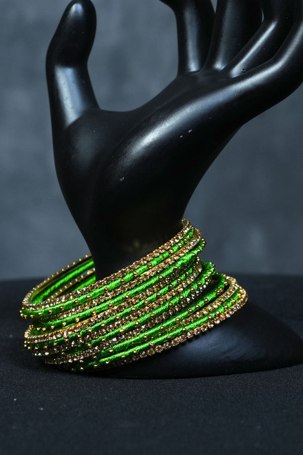 Luxury Radiance: 23 Silk Thread Bangles with Golden Bead Elegance