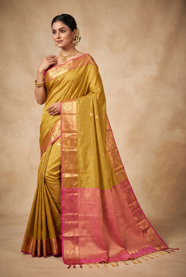 Mustard Semi Soft Silk Saree with Delicate Gold Zari Buttas and Traditional Floral Border