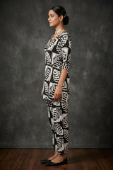 Black & White Rayon Printed Kurti Set with Beaded Neck and Elastic Pant — side pose