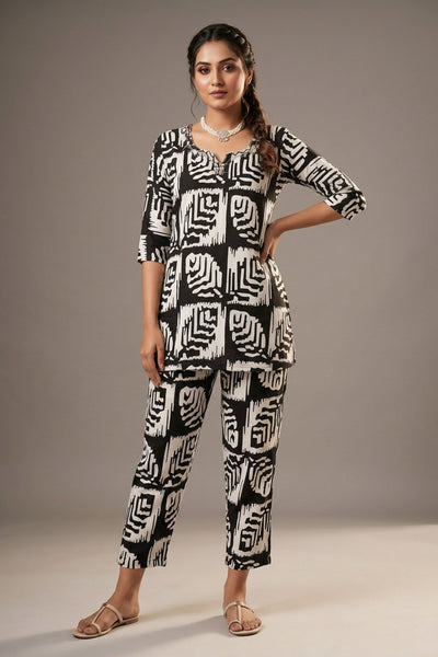 Black & White Rayon Printed Kurti Set with Beaded Neck and Elastic Pant — front pose