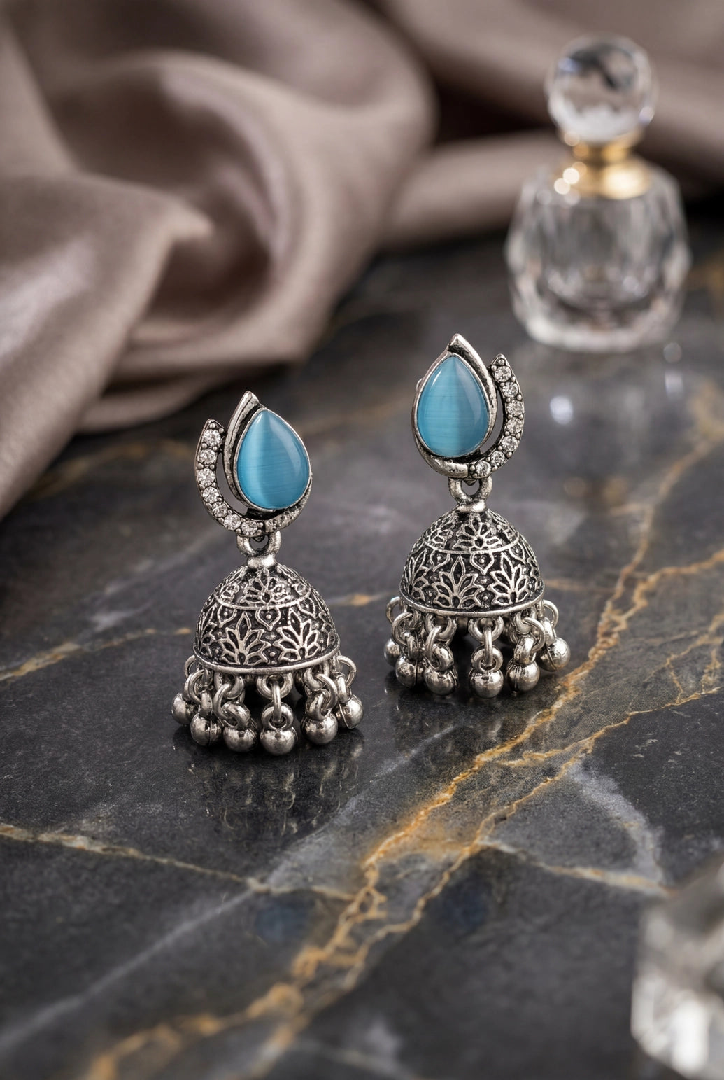 Oxidized Silver-Tone Oval Stone Jhumka Earrings with Floral Cutwork & Ghunghroo Beads - Sea blue