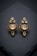 Light Pink Oval Stud Earrings with Antique Gold-Tone Detail and Tiny Bead Accents for Traditional Wear - Light Pink
