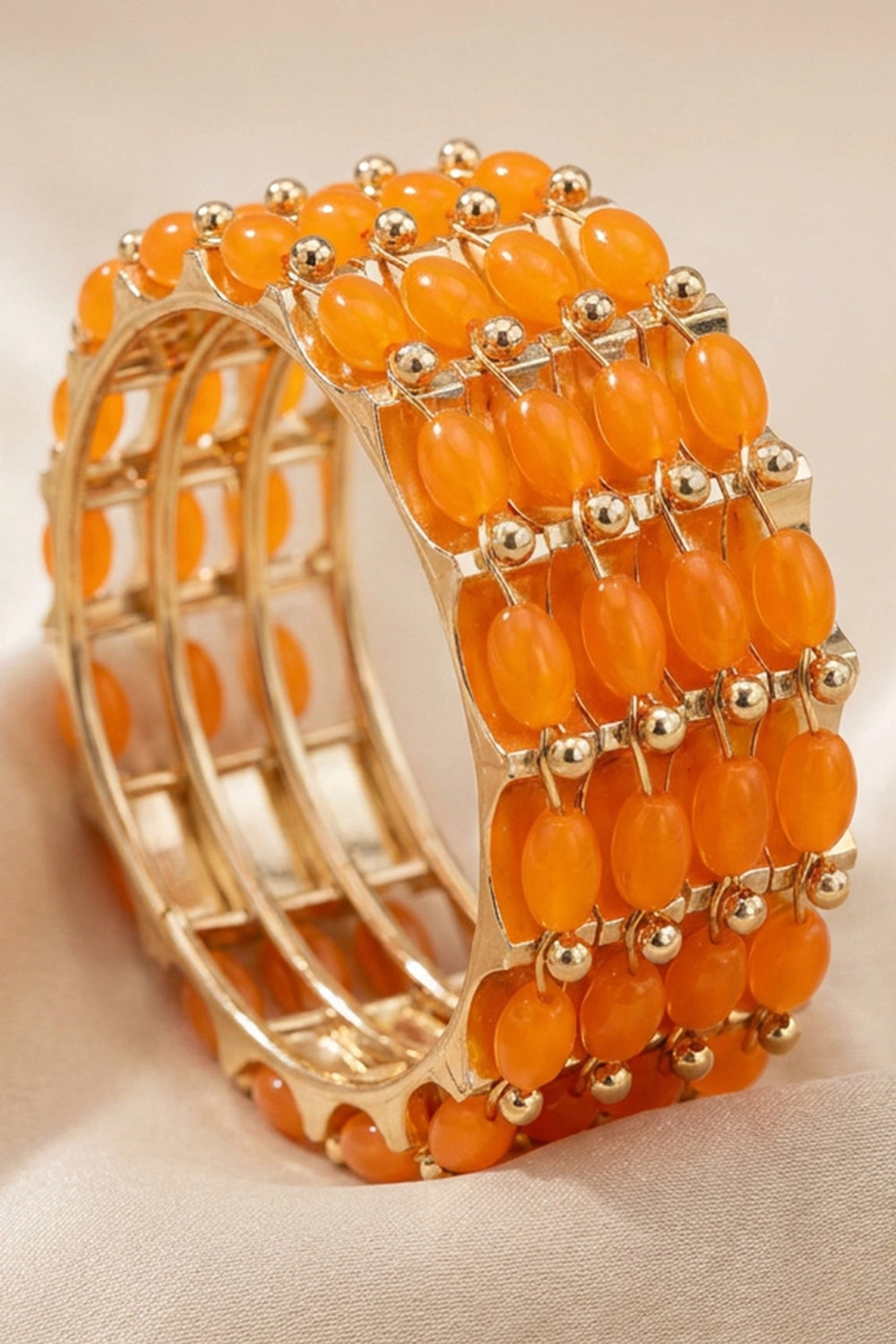 Traditional Gold-Plated Beaded Bangles Set with Stone Work for Festive Wear (Orange/Peach/Black)