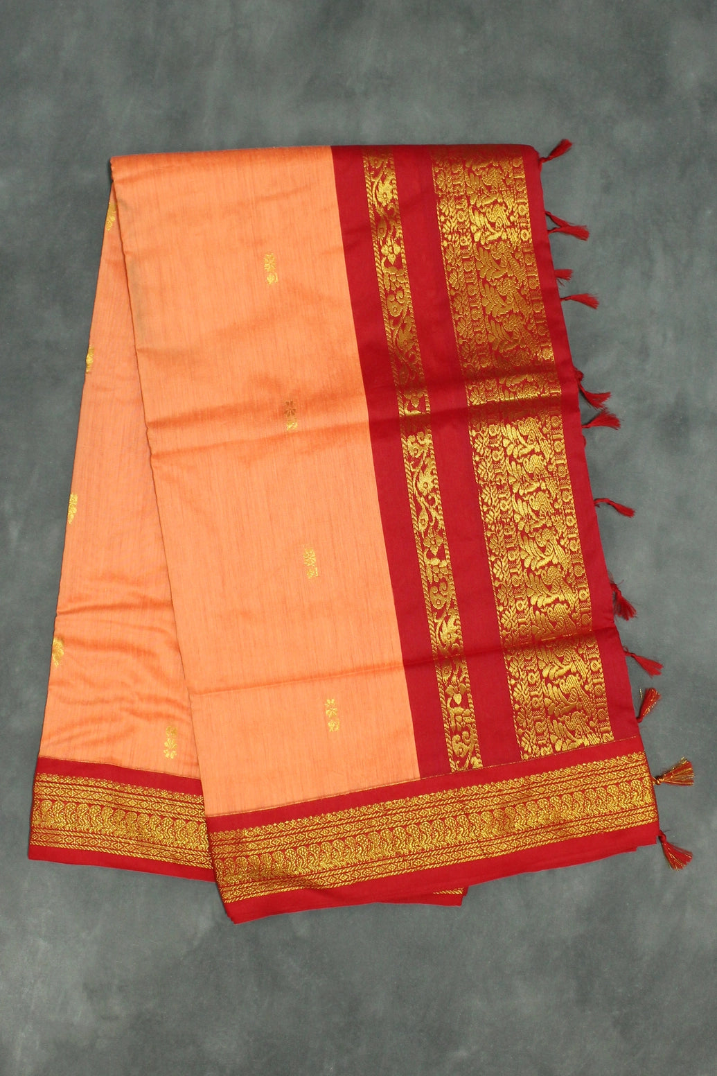 Silk cotton sarees with grand pallu and thick Zari border both sides. Full body small butties. With blouse - Orange & Red