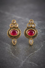 Red Oval Stone Antique Finish Stud Earrings with Gold-Tone Bead Detailing for Traditional & Festive Wear - Red