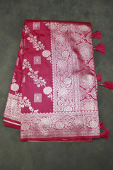 beautifully adorned with intricate zari weaving banarasi saree. The saree features delicate floral motifs woven across the body, complemente - Pink
