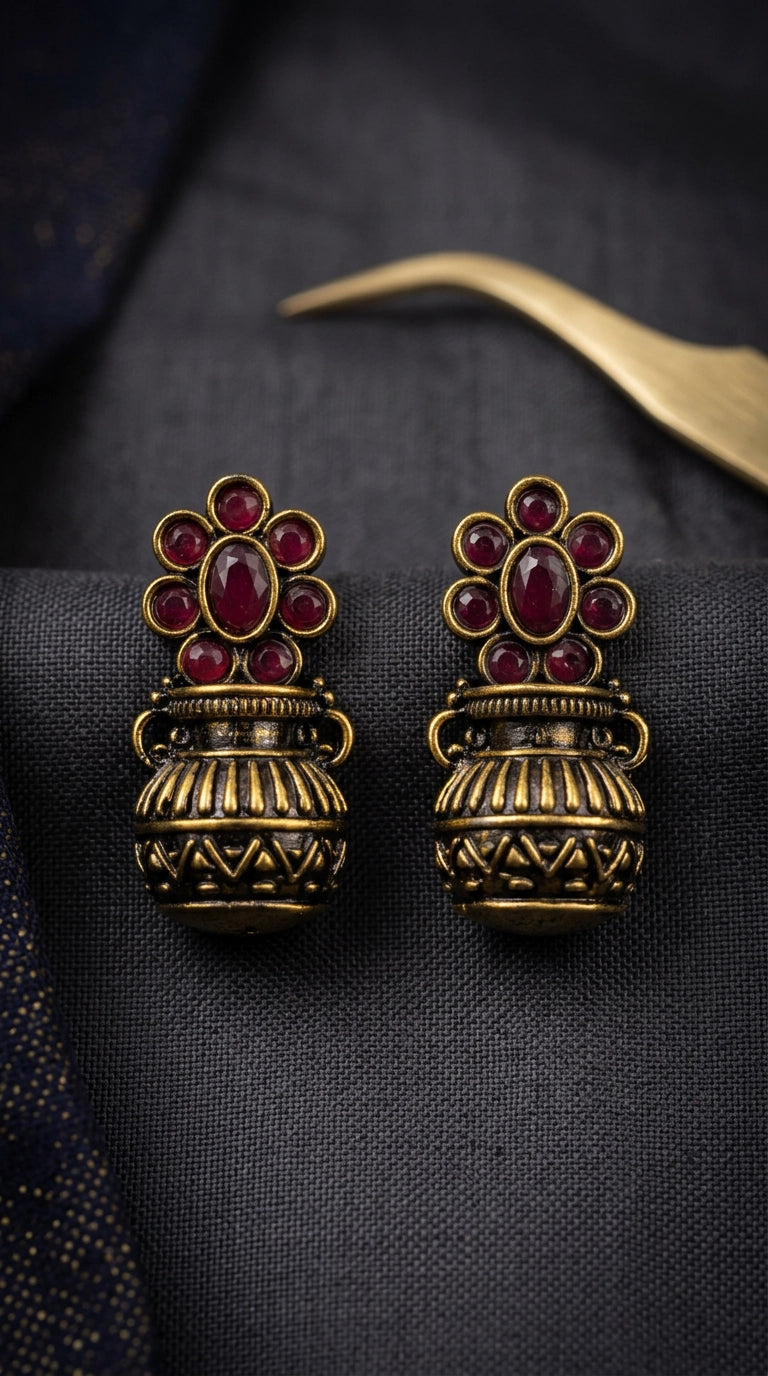 Red Antique Gold-Tone Jhumka Earrings with Floral Stud Design and Red Crystal Stones - Red