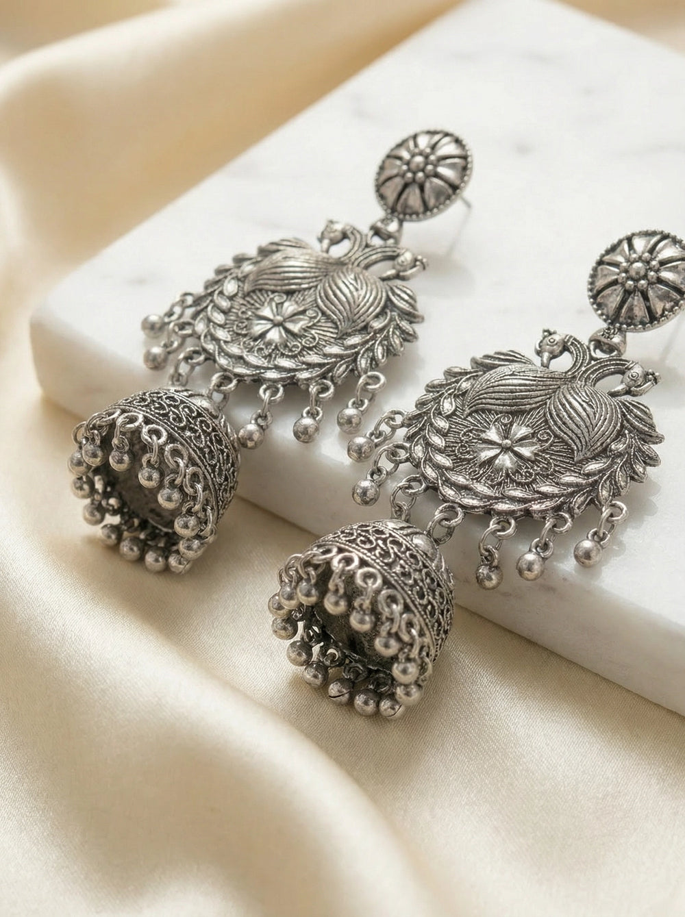 Oxidized Black Silver Jhumka Earrings with Floral Leaf Engraving and Dangling Beads for Traditional Wear - Black silver