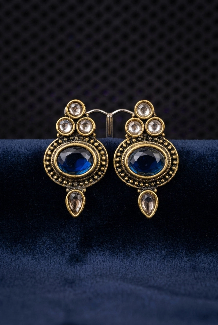 Navy Blue Antique Finish Stud Earrings with Oval Center Stone & Gold-Tone Beaded Details for Ethnic Wear