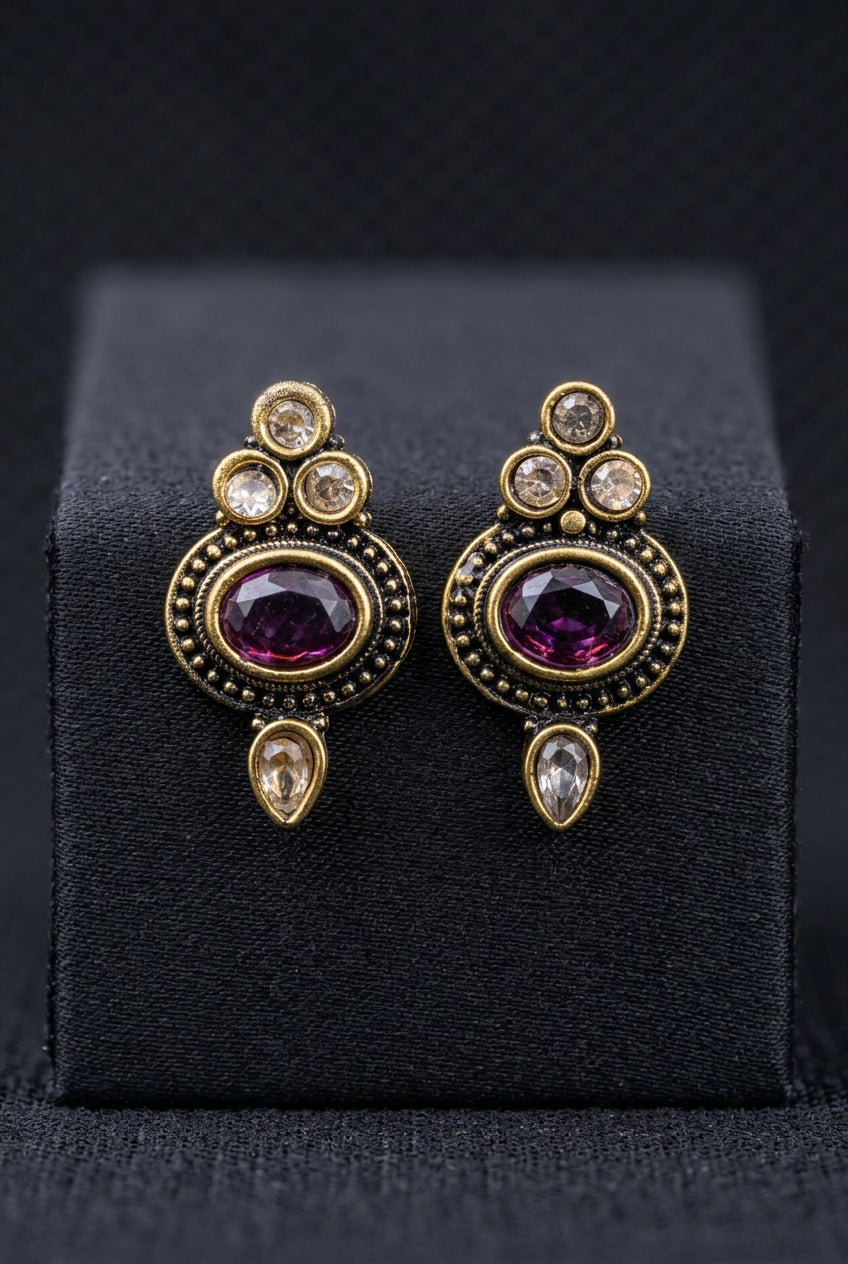 Purple Oval Stone Antique Finish Stud Earrings with Gold-Tone Detailing for Traditional & Festive Wear - Purple