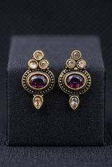 Purple Oval Stone Antique Finish Stud Earrings with Gold-Tone Detailing for Traditional & Festive Wear - Purple