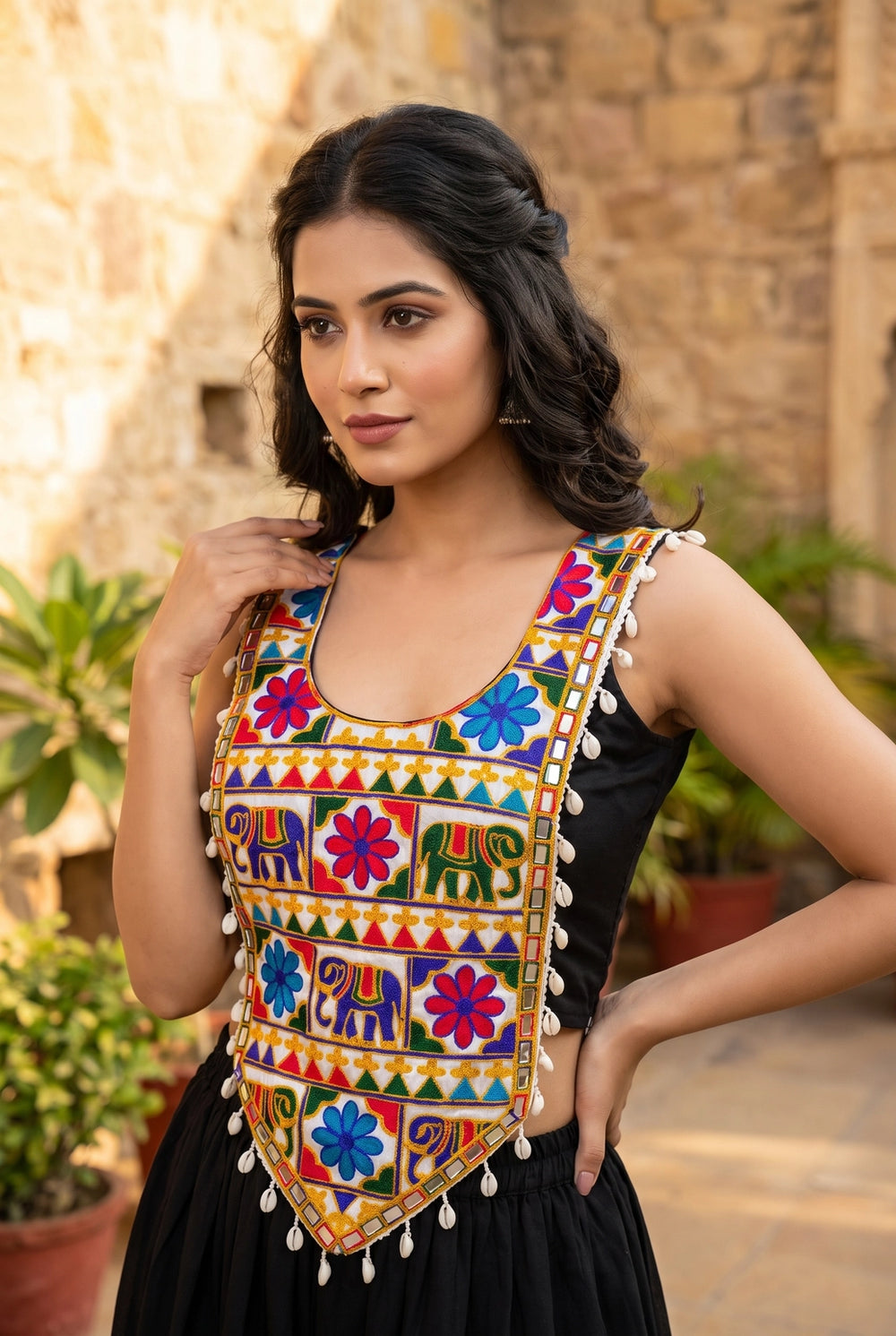 Kutchi Mirror-Work Navratri Blouse with Elephant Motif and Cowrie Border, Sleeveless Ethnic Wear for Women