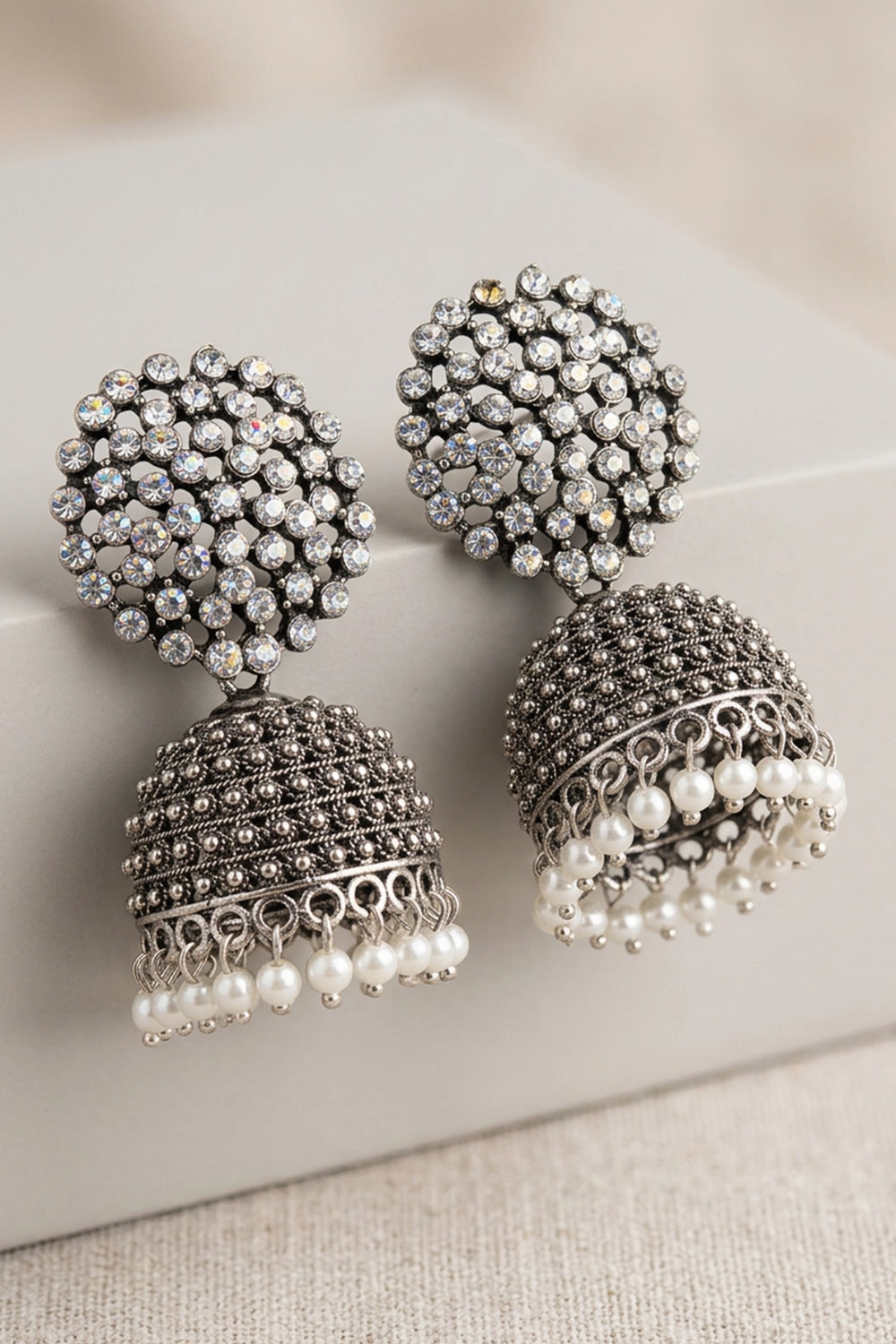 Oxidized Silver Tone Jhumka Earrings with White Stone Stud Top and Pearl Drop Dangles - Black silver