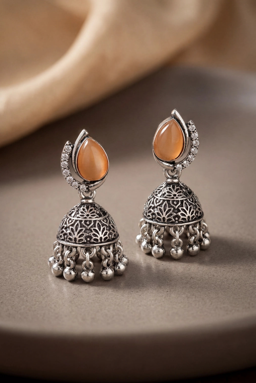 Oxidized Silver-Tone Oval Stone Jhumka Earrings with Floral Cutwork & Ghunghroo Beads