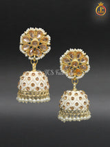 Elegant Kundan Jhumka Earrings With stones and imitation pearls.