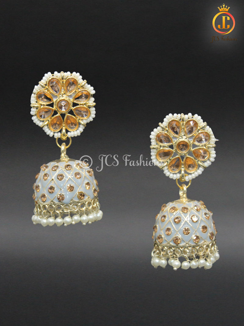 Elegant Kundan Jhumka Earrings With stones and imitation pearls.