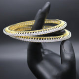 White stone bangles in gold polish